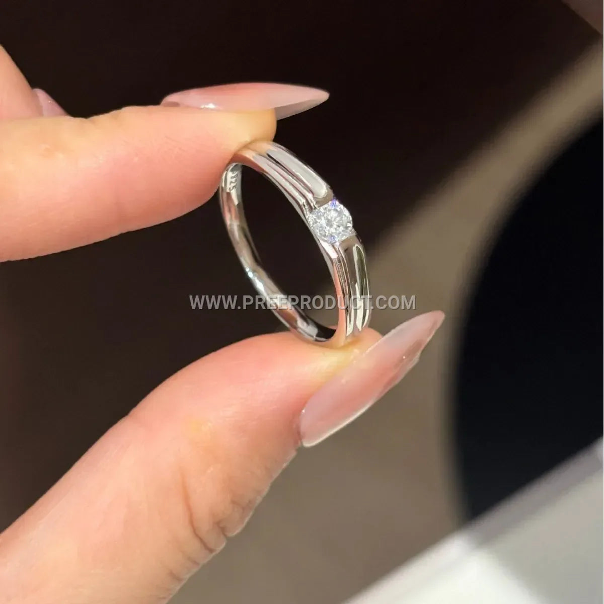 Möbius Moissanite Solitaire Ring in Sterling Silver