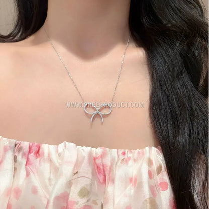 Pave Bowknot Moissanite Pendant Necklace in Sterling Silver